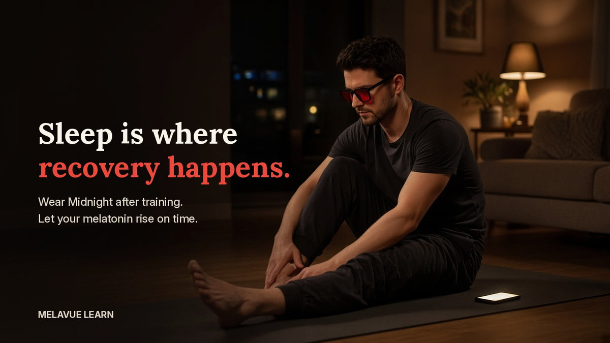 A man stretching in a dim living room at night after training, wearing Melavue Midnight red lens glasses