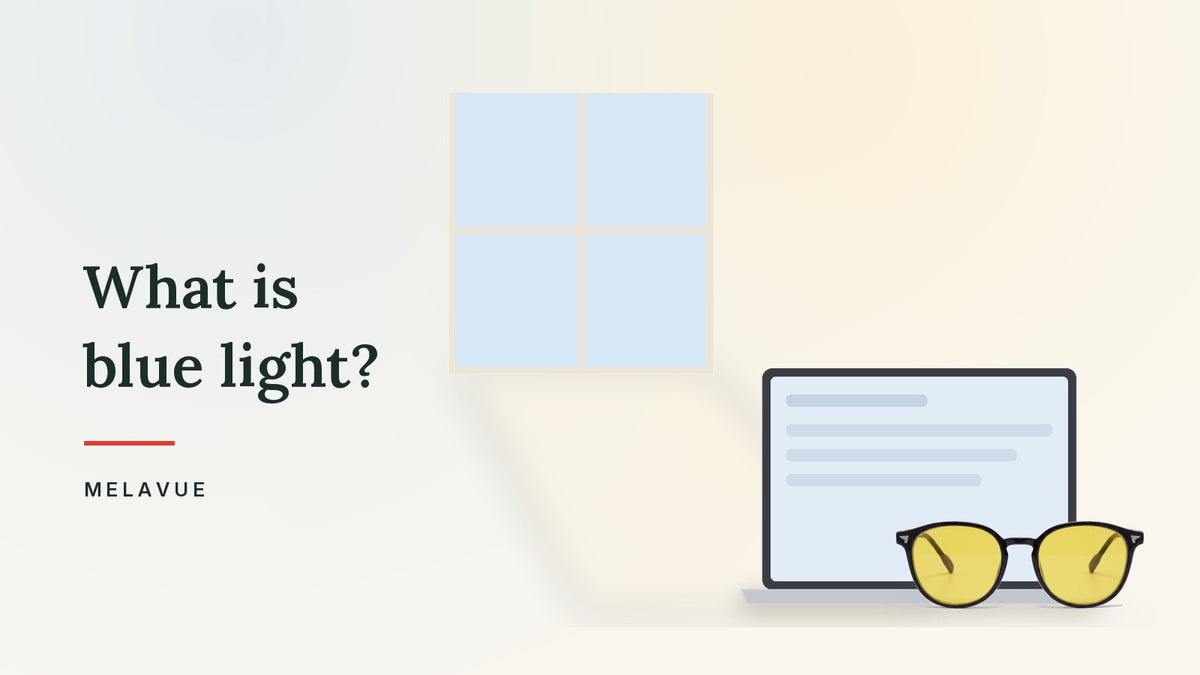 Sunlight through a window falling across a cream desk with Melavue DayLight yellow lens glasses beside a laptop